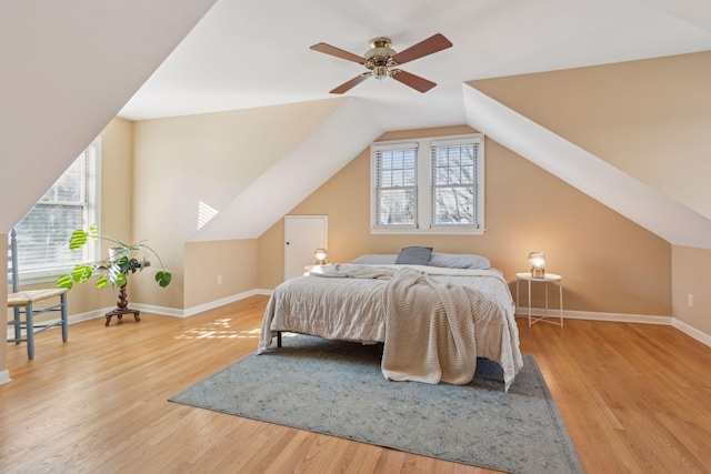 bedroom featuring lofted ceiling and hardwood / wood-style floors