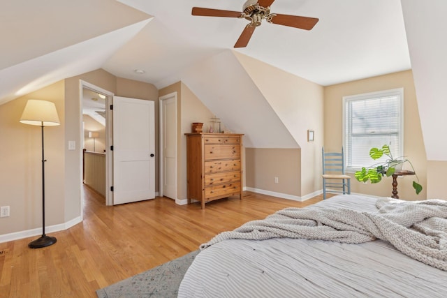 bedroom featuring lofted ceiling, hardwood / wood-style flooring, and ceiling fan