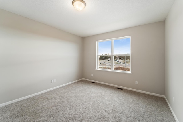 empty room featuring carpet floors