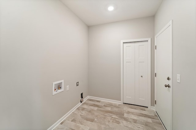 laundry area with hookup for a washing machine and hookup for an electric dryer