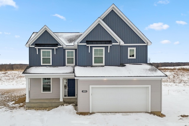 modern farmhouse style home with board and batten siding, a standing seam roof, a porch, and an attached garage