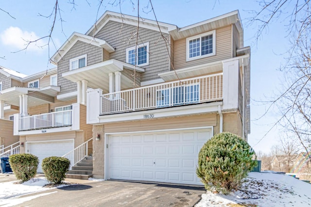 view of property featuring driveway and an attached garage