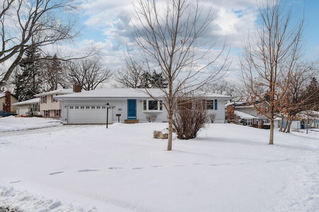 single story home with a chimney and an attached garage