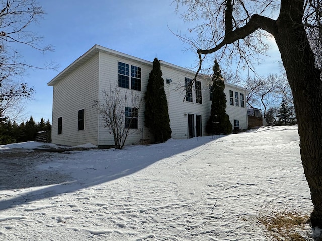 view of snow covered house