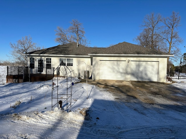 view of front of house featuring a garage and a deck