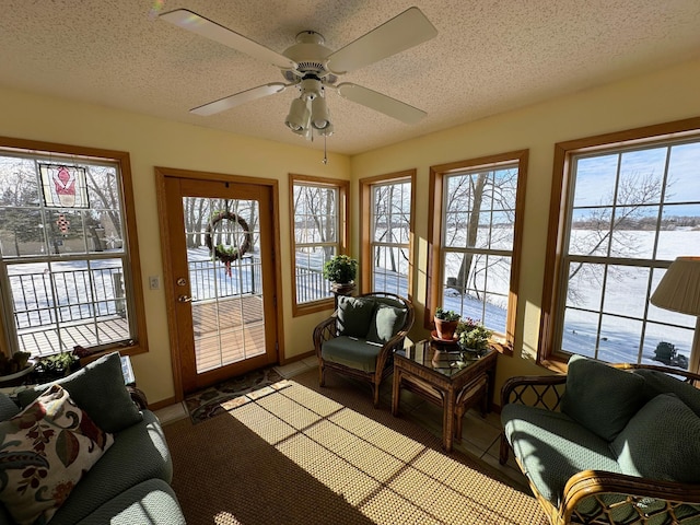 sunroom / solarium with ceiling fan