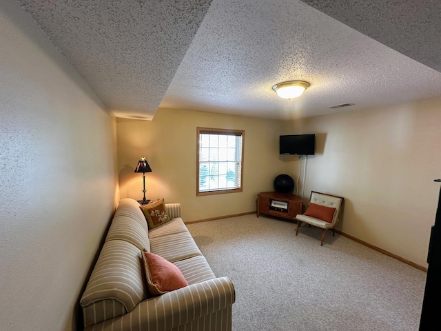 living room featuring a textured ceiling and carpet flooring