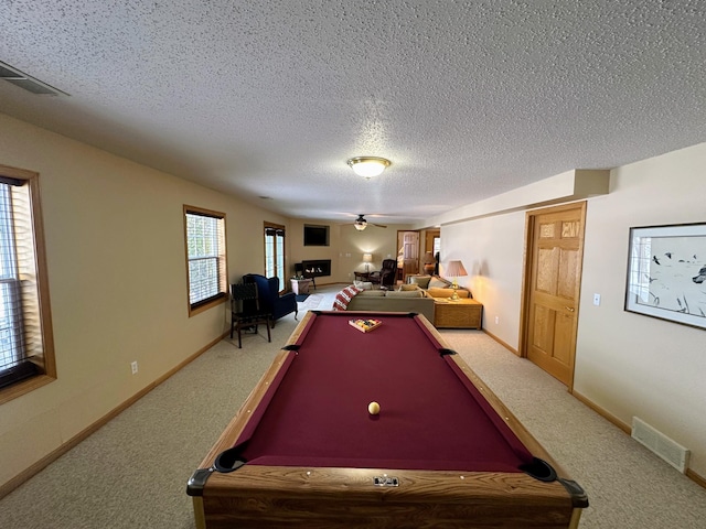 recreation room with ceiling fan, carpet flooring, billiards, and a textured ceiling