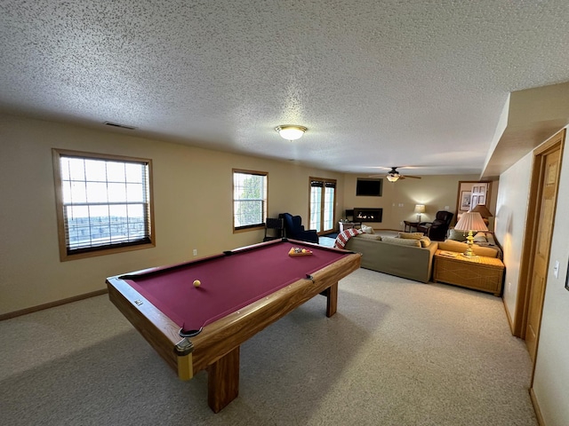 game room featuring carpet floors, a textured ceiling, ceiling fan, and billiards