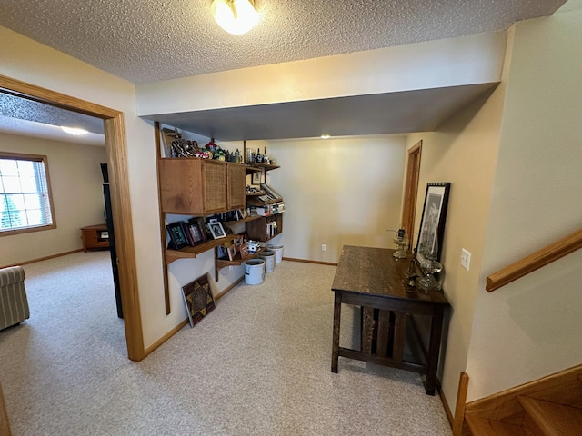 carpeted living room featuring a textured ceiling