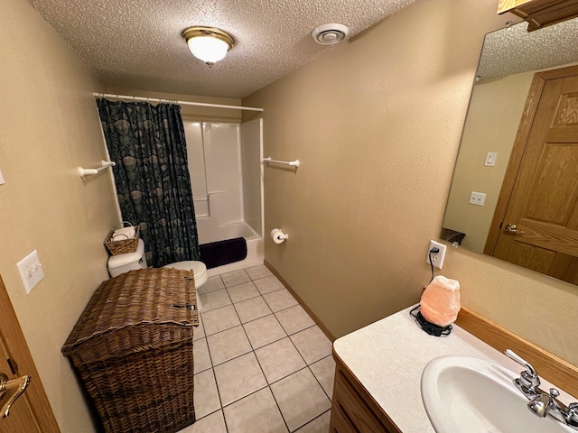 bathroom with toilet, curtained shower, tile patterned flooring, and a textured ceiling