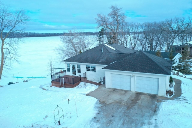 exterior space with a wooden deck and a garage