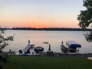 property view of water featuring a boat dock