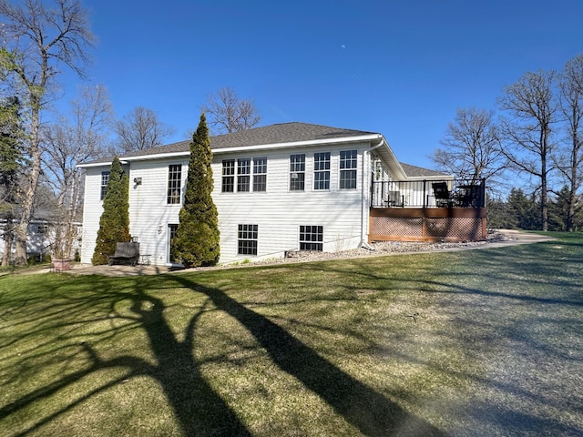 43561 Paul Lake Dr, Edna Twp, MN 56573 - back of house with a yard, roof with shingles, and a deck