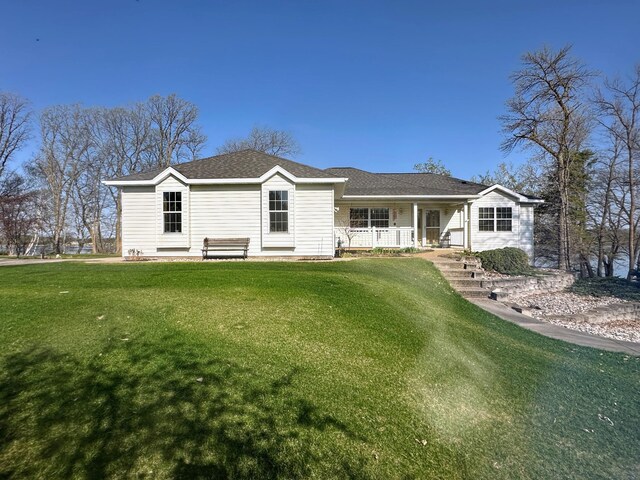 43561 Paul Lake Dr, Edna Twp, MN 56573 - view of front of home with a porch and a front lawn