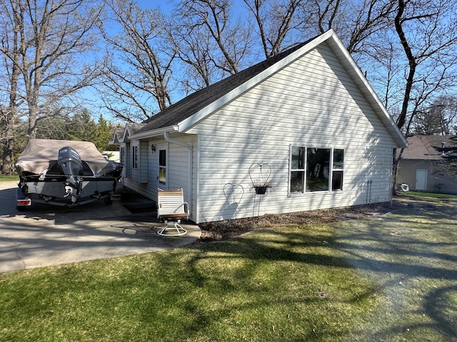 43561 Paul Lake Dr, Edna Twp, MN 56573 - view of property exterior featuring a yard and roof with shingles