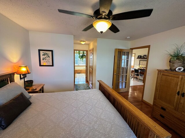 43561 Paul Lake Dr, Edna Twp, MN 56573 - bedroom featuring a textured ceiling and a ceiling fan