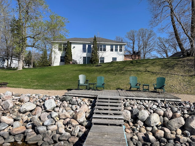 43561 Paul Lake Dr, Edna Twp, MN 56573 - rear view of house with a lawn and a deck