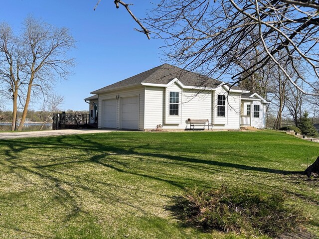 43561 Paul Lake Dr, Edna Twp, MN 56573 - view of front of home featuring a front lawn and an attached garage