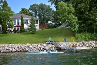 43561 Paul Lake Dr, Edna Twp, MN 56573 - dock area with a water view and a yard