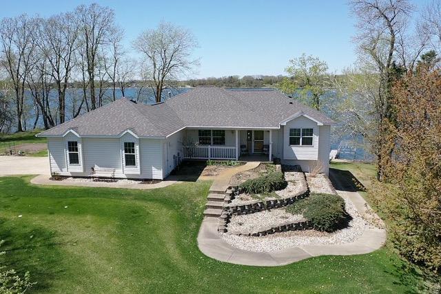 43561 Paul Lake Dr, Edna Twp, MN 56573 - view of front of home with a porch and a front yard
