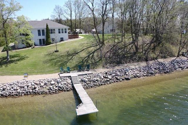 43561 Paul Lake Dr, Edna Twp, MN 56573 - dock with a yard and a water view