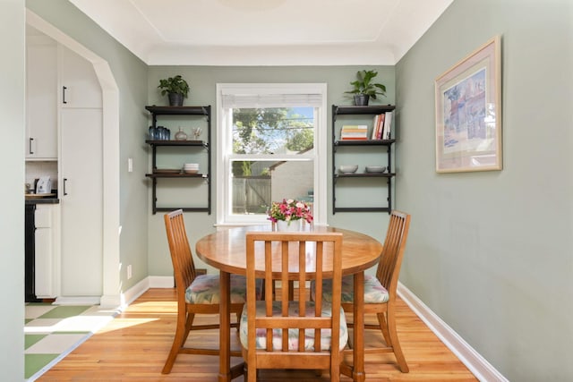 dining space with light hardwood / wood-style floors