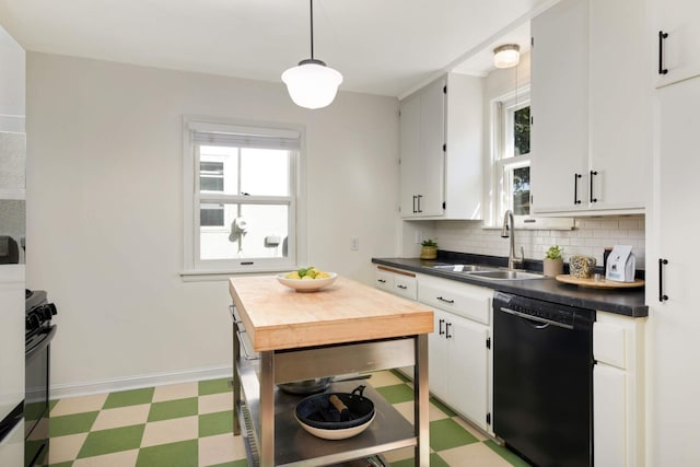 kitchen featuring dishwasher, sink, white cabinets, and decorative light fixtures