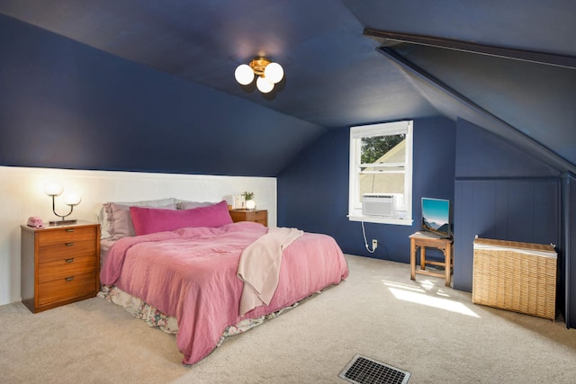 bedroom featuring cooling unit, vaulted ceiling, and light carpet