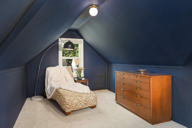 living area with lofted ceiling and light carpet