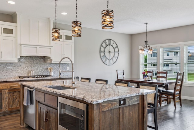 29135 Scenic Dr, Chisago City, MN 55013 - kitchen featuring stainless steel appliances, dark wood-type flooring, backsplash, white cabinets, and recessed lighting