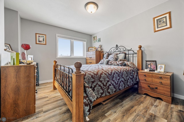 bedroom with wood-type flooring