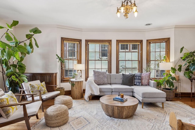 sunroom / solarium with a chandelier