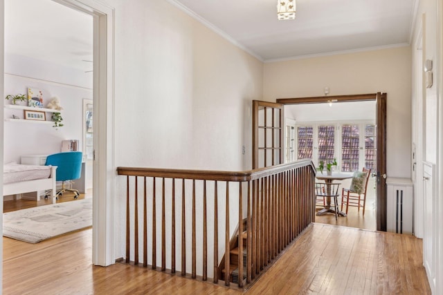 hall with crown molding and hardwood / wood-style floors