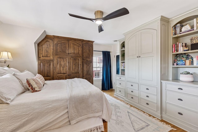 bedroom with ceiling fan and light hardwood / wood-style flooring