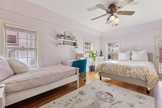 bedroom with hardwood / wood-style flooring and ceiling fan