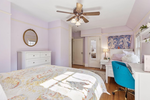 bedroom with ceiling fan and light hardwood / wood-style floors