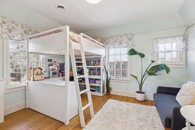 bedroom with light hardwood / wood-style floors