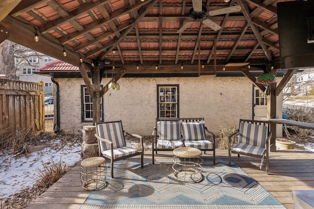 snow covered deck with an outdoor living space, a gazebo, and ceiling fan