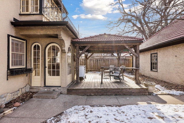 snow covered deck with a gazebo