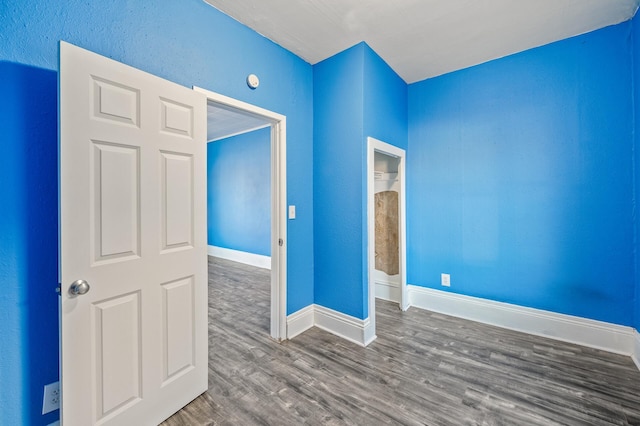 empty room with hardwood / wood-style flooring