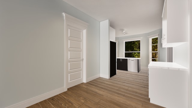 hallway with light wood-type flooring