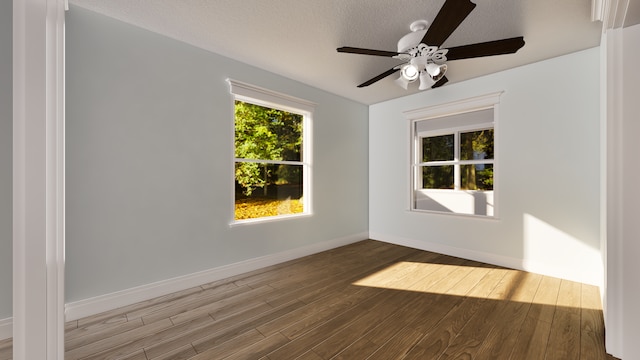 unfurnished room featuring ceiling fan, wood-type flooring, and a textured ceiling