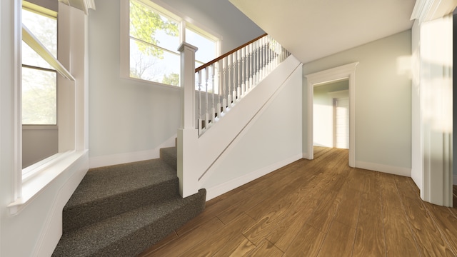 stairs with hardwood / wood-style floors