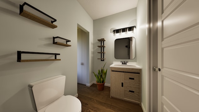 bathroom with wood-type flooring, toilet, and vanity