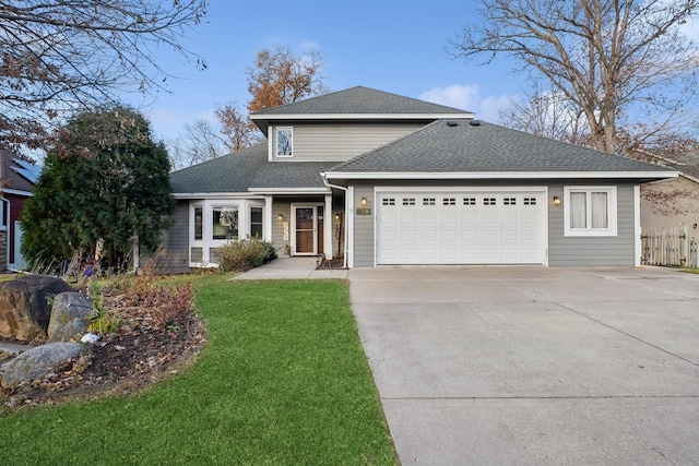 front facade with a garage and a front yard