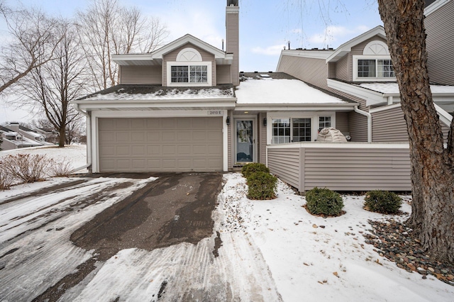 front of property with a garage