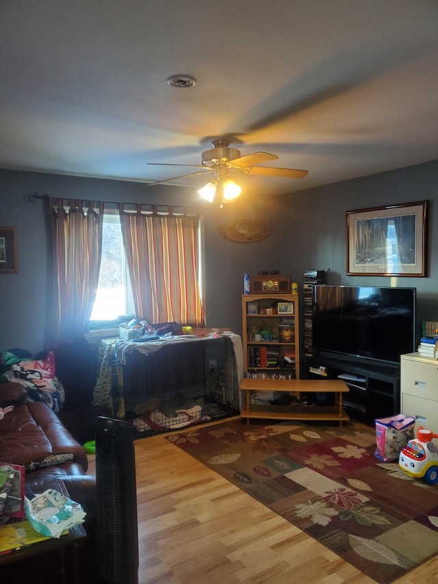 bedroom with ceiling fan and hardwood / wood-style flooring