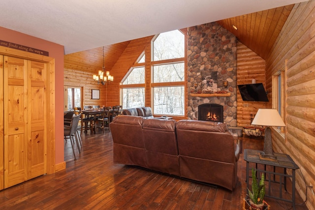 living room featuring wood ceiling, dark hardwood / wood-style flooring, rustic walls, a chandelier, and vaulted ceiling