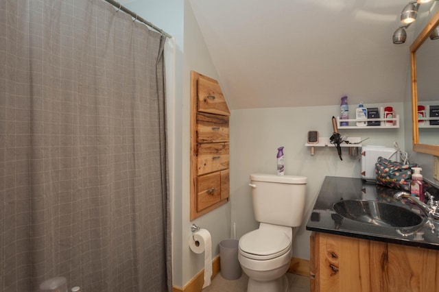 bathroom featuring curtained shower, toilet, lofted ceiling, and vanity